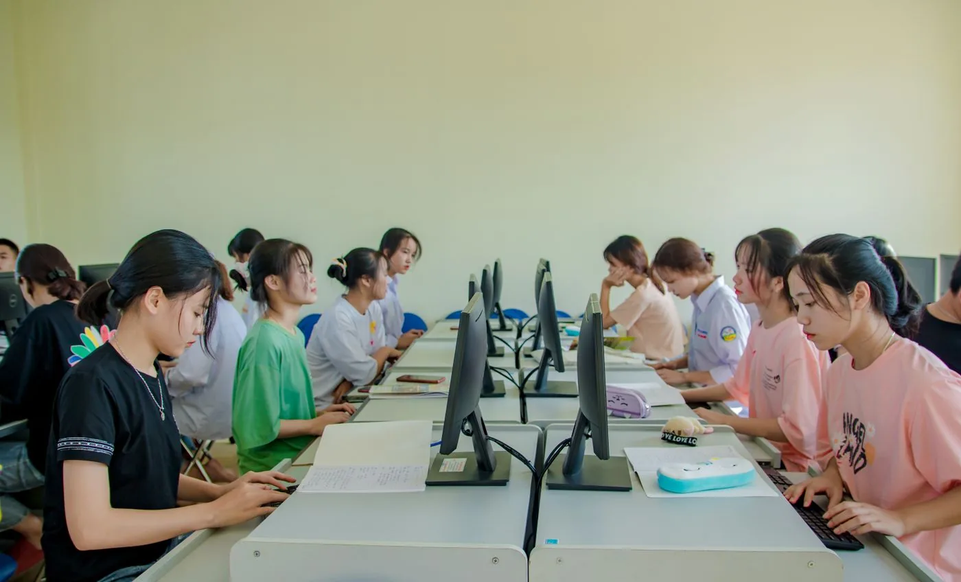 A student practising on a computer in class